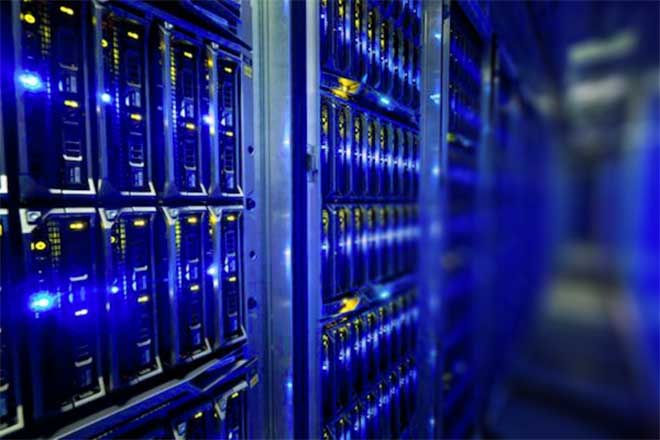 Rows of blue-lit server racks in a data center.